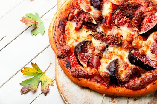 Homemade tasty meat pizza with figs. Flat lay