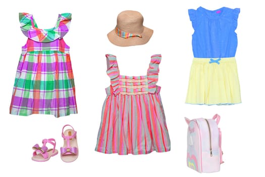 Collage set of girl beach summer clothes isolated. Female kids apparel collection. Child baby fashion clothing outfit. Colorful stylish dresses, hat, shoes, bag wearing.