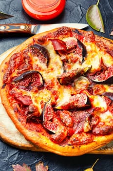 Homemade tasty meat pizza with figs. Flat lay