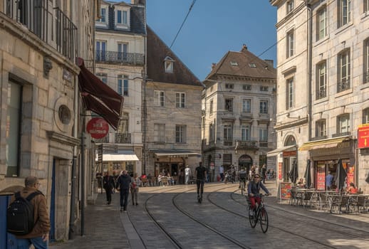 View of unidentified people on a street in Besancon, France