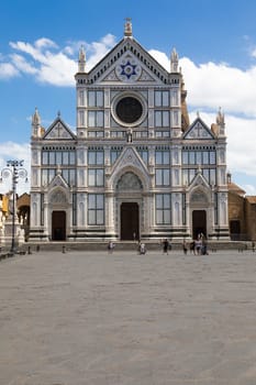 Florence, Italy - June 2022: Basilica of Santa Croce, blue sky and clouds