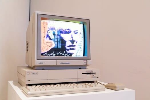 Venaria Reale, Italy - October 2022: Computer Commodore Amiga 1000 with floppy disk, mouse, beige
