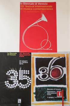 Venice, Italy - September 6, 2022:  59th Venice Art Biennale in Venice. Old posters advertising the Venice Biennale presented in the central pavilion in Giardini