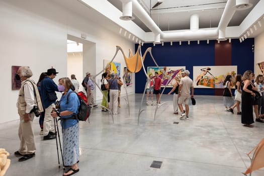 Venice, Italy - September 6, 2022: People visiting one of the many exhibitions at the Biennale Central Pavilion located in Giardini in Venice. Italy