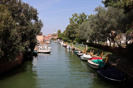 Venice, Italy - Sept 6, 2022: 59th A typical Venetian canal situated in the grounds of the Giardnini garden in Venice