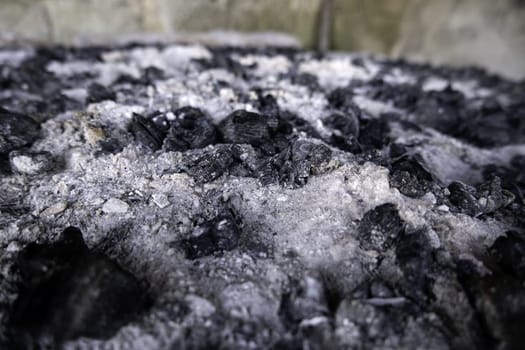 Detail of burnt charcoal for fire and cooking, celebration meal