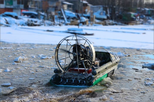 airboat in motion in winter back view