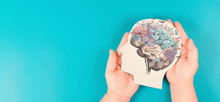 Hands holding paper head, human brain with flowers, self care and mental health concept, positive thinking, creative mind, generative AI used for brain