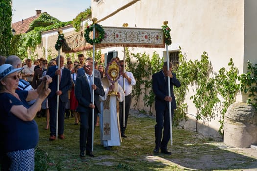 Monstrance bearer during Corpus Christi procession in the Austrian village of Duernstein