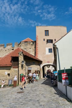 Tourists at the Kremser Tor, Krems Gate, the eastern city gate of Duernstein in Austria