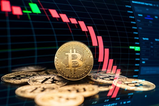 Bitcoin and cryptocurrency investing crash concept. Bitcoin cryptocurrency symbol with coins on black background. Trading on the cryptocurrency exchange