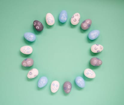Flat Lay With Copy Space For Free Text. Easter Egg Arrangement, Decoration And Ornament. Light Green Paper Background