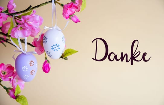 Beautiful Easter Egg Decoration With Spring Flowers. German Text Danke Means Thank You. Seasonal Easter Holiday Greeting Card.