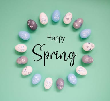 Flat Lay With English Text Happy Spring. Easter Egg Arrangement, Decoration And Ornament. Light Green Paper Background