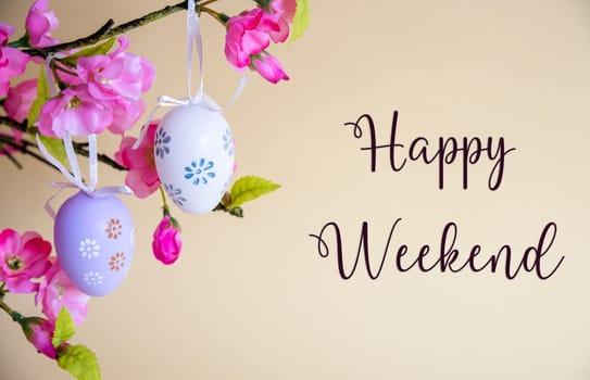 Beautiful Easter Egg Decoration With Spring Flowers. English Text Happy Weekend. Seasonal Easter Holiday Greeting Card.