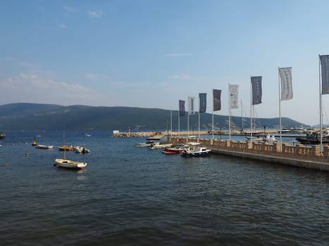 Meljine, Herceg Novi, Montenegro, August 13 2022 Boats, yachts and ships are at anchor. Moored ships in the parking lot. Adriatic Sea Mediterranean. Travel business. Sea travel and sports. Summertime