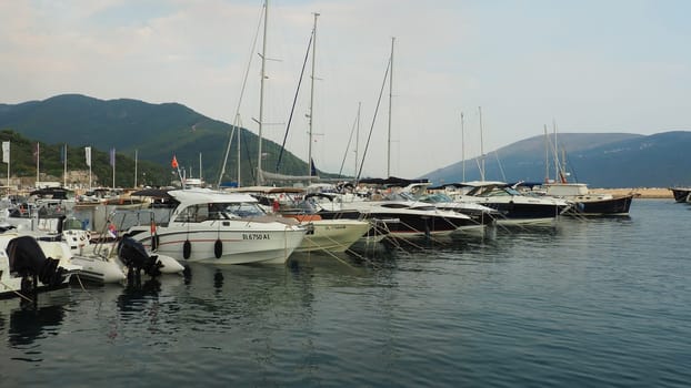 Meljine, Herceg Novi, Montenegro, August 13 2022 Boats, yachts and ships are at anchor. Moored ships in the parking lot. Adriatic Sea Mediterranean. Travel business. Sea travel and sports. Summertime