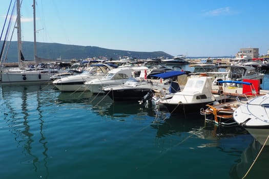 Meljine, Herceg Novi, Montenegro, August 13 2022 Boats, yachts and ships are at anchor. Moored ships in the parking lot. Adriatic Sea Mediterranean. Travel business. Sea travel and sports. Summertime