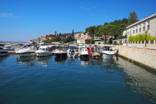 Meljine, Herceg Novi, Montenegro, August 13 2022 Boats, yachts and ships are at anchor. Moored ships in the parking lot. Adriatic Sea Mediterranean. Travel business. Sea travel and sports. Summertime