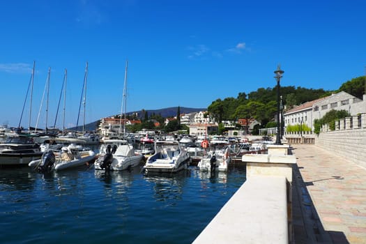 Meljine, Herceg Novi, Montenegro, August 13 2022 Boats, yachts and ships are at anchor. Moored ships in the parking lot. Adriatic Sea Mediterranean. Travel business. Sea travel and sports. Summertime