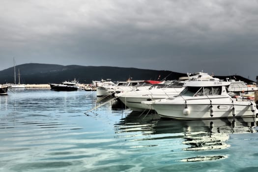 Meljine, Herceg Novi, Montenegro, August 13 2022 Boats, yachts and ships are at anchor. Moored ships in the parking lot. Adriatic Sea Mediterranean. Travel business. Sea travel and sports. Summertime