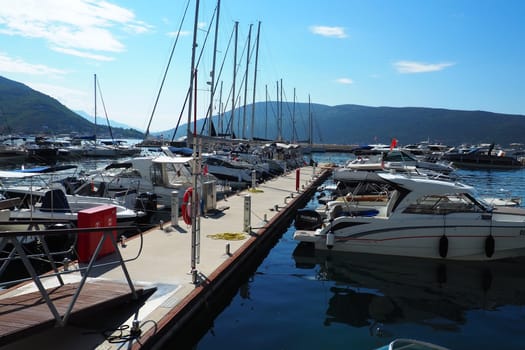 Meljine, Herceg Novi, Montenegro, August 13 2022 Boats, yachts and ships are at anchor. Moored ships in the parking lot. Adriatic Sea Mediterranean. Travel business. Sea travel and sports. Summertime