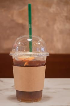 Iced coffee with orange in coffee shop, stock photo