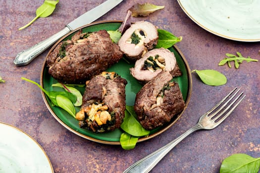 Veal meat rolls stuffed with mushrooms and herbs. Dish of beef