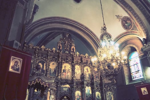 Sremska Mitrovica, Serbia 26 June 2022, Basilica of St. Demetrius, Sabor Church. Altar, icons, a large church chandelier under the arch. Arches and church utensils. Neoclassical architecture. Interior