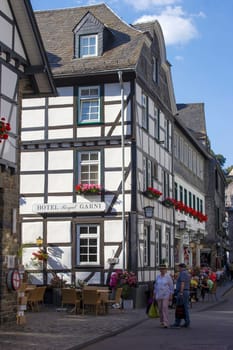MONSCHAU, GERMANY - SEPTEMBER 22, 2020: small town Monschau with unidentified people. The historic town center has many half-timbered houses and narrow streets remained nearly unchanged for 300 years