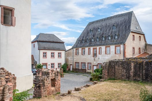 courtyard of the castle veste Otzberg during summer with tower, building facade and wall
