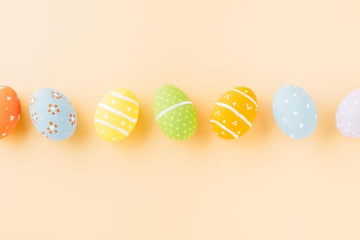 Overhead easter eggs isolated on pastel background with copy space, Funny decoration, Happy Easter Day greeting card, Creative composition banner web design holiday background, flat lay top view