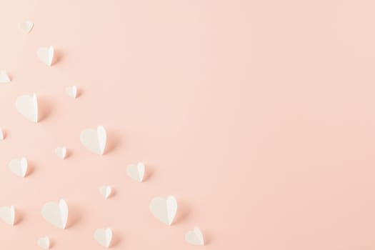 Happy Valentines Day background. Top view flat lay of paper elements cutting white hearts shape flying on pink background with copy space, Happy Mother's Day, Banner template design of holiday
