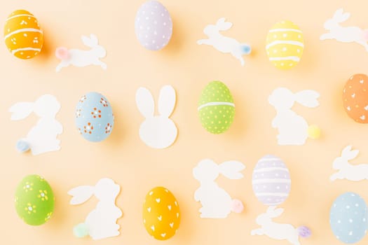 Easter eggs bunny and rabbit white paper cutting isolated on pastel background. Funny decoration, Happy Easter Day, Festive composition banner design holiday background