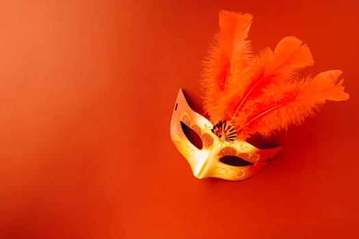 Happy Purim carnival. Carnival mask for Mardi Gras celebration isolated on red background banner design with copy space, jewish holiday, Purim in Hebrew holiday carnival ball, Venetian mask