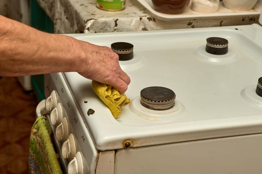 wet cleaning of the gas stove. High quality photo