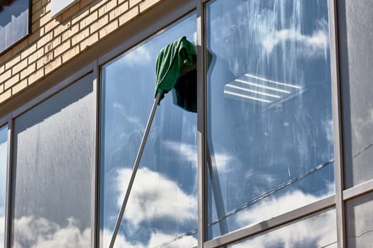 window washing, washing a street shop window. High quality photo