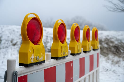 Closed because of snow, fence do not pass. barricade