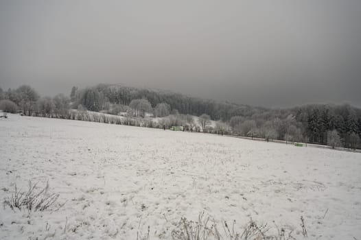 Beautiful winter landscape with lots of snow and trees in odenwald, germany