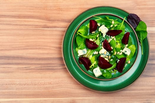 Spring or summer salad with beetroot, cheese, herbs and pine nuts. Diet detox raw food