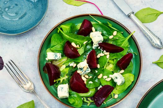Spring or summer salad with beetroot, cheese, herbs and pine nuts. Diet detox raw food