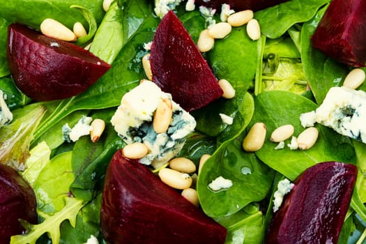 Spring or summer salad with beetroot, cheese, herbs and pine nuts. Diet detox raw food