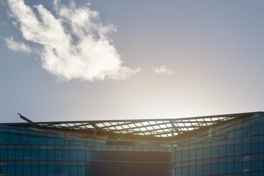 London, United Kingdom - December 03, 2006: Sun backlight over glass and steel office buildings roof ("More London Estates"" design by Foster and Partners). Example of modern architecture in UK capital"