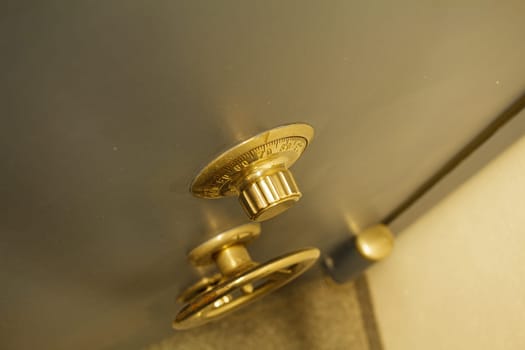 Close-up of an old bank safe with combination lock