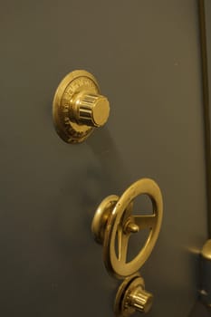 Close-up of an old bank safe with combination lock
