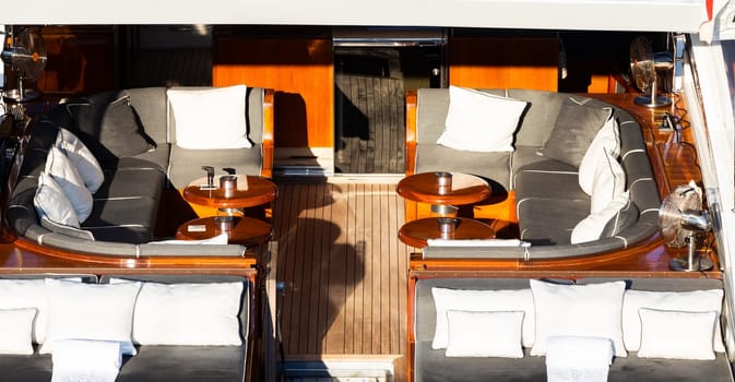 Luxury yacht. Comfortable expensive wooden design and furniture for holiday recreation tourism or travel and wealth concept