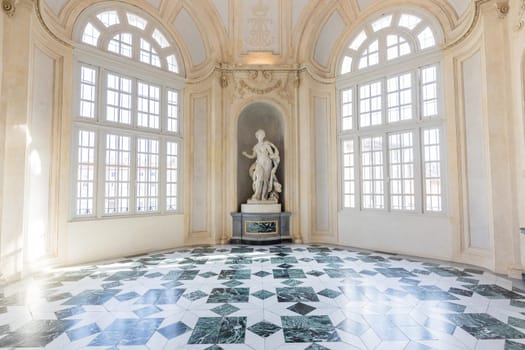 Venaria Reale, Italy - January 2023: luxury interior old royal palace. Gallery perspective with window