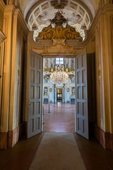 Italy, Stupinigi - January 2023: luxury interior of Royal Palace with baroque marbles and windows