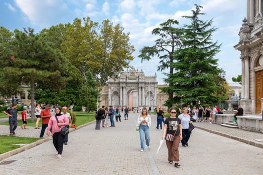 Istanbul, Turkey - August 31, 2022: Entrance of Dolmabahce Palace, with tourists visiting the place