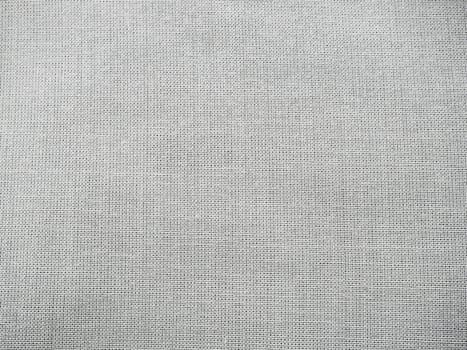 Texture canvas fabric as background. Gray sackcloth. Grey linen scrim.
